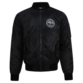 A black nylon bomber jacket with a full front zipper, ribbed collar, cuffs, and hem, featuring a circular white embroidered logo on the left chest and a zippered sleeve pocket.